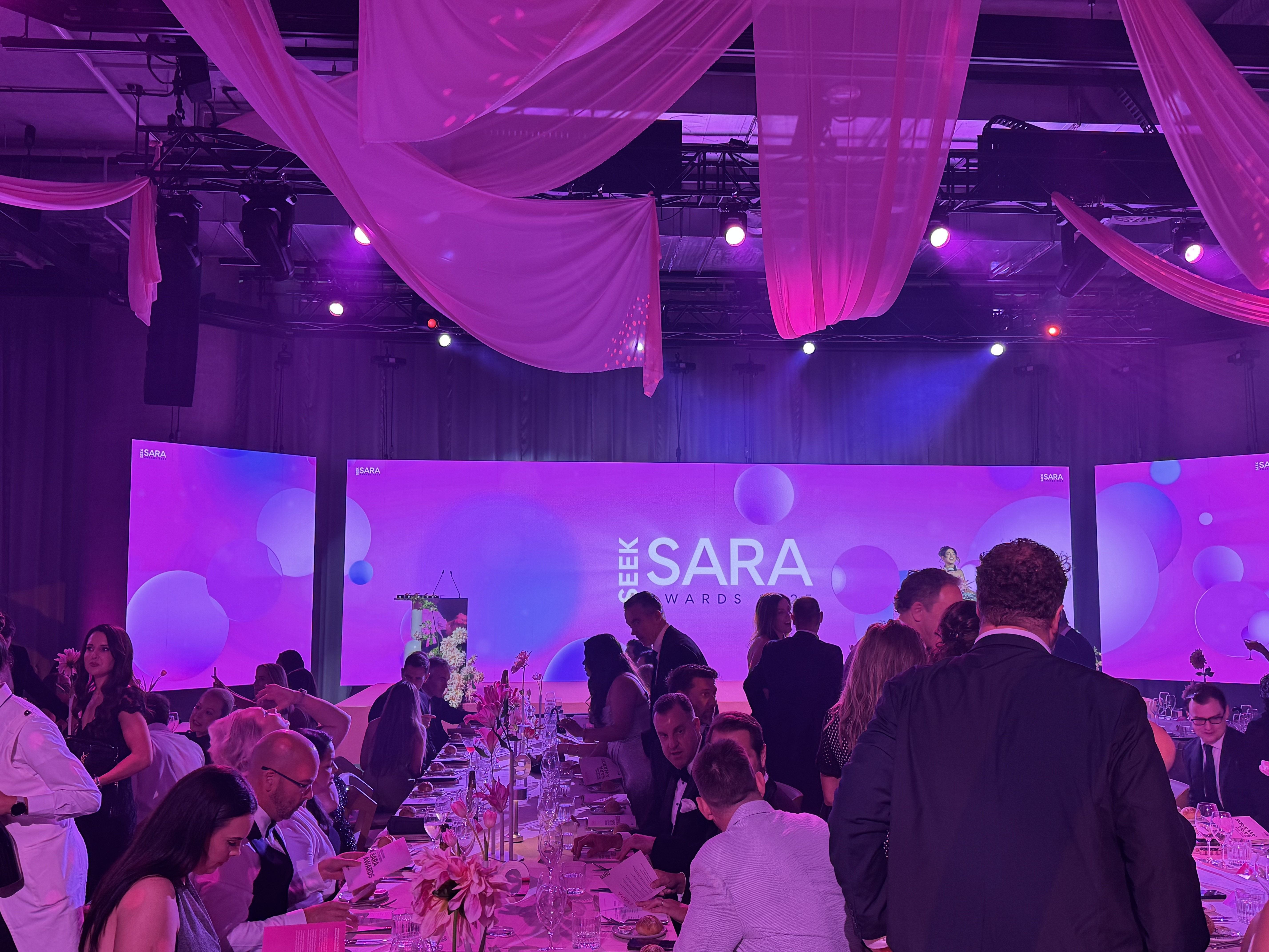 Guests gathered in the gala venue with the SEEK SARA Awards stage in the background.